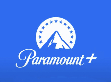 Paramount+ app interface on a phone, displaying a variety of content including live sports like NFL and UEFA Champions League.