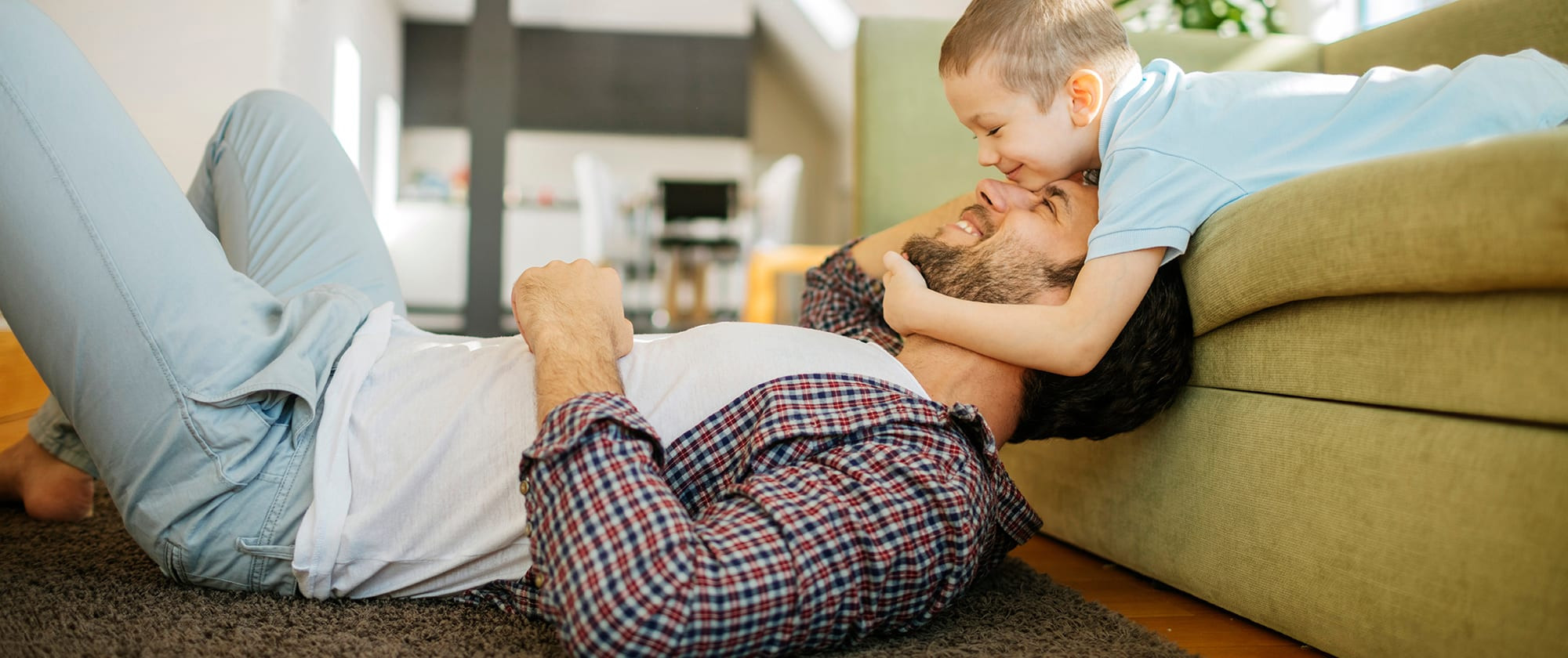 a father and son play after their air conditioning service is completed by an ac company near me