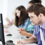 Student taking an exam in a classroom