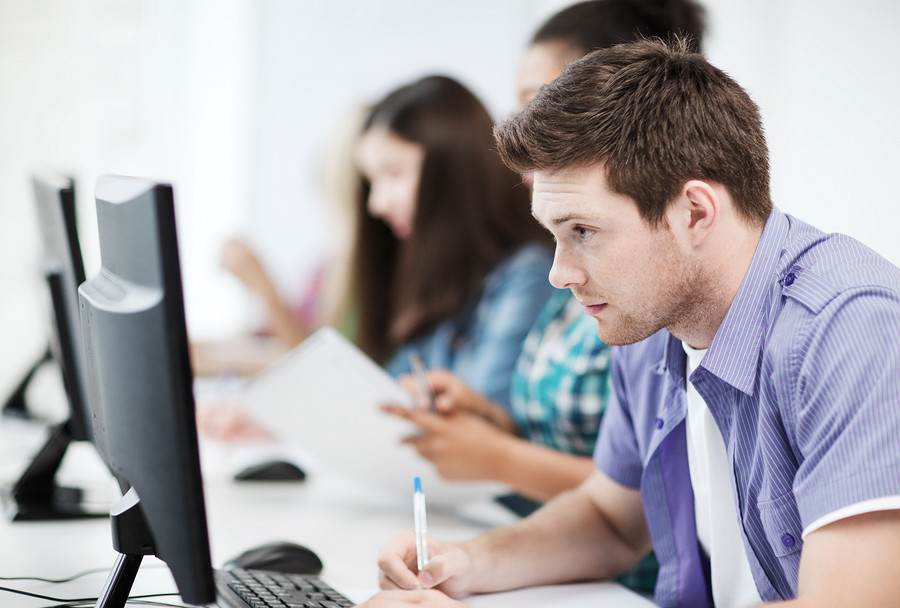 Student taking an exam in a classroom