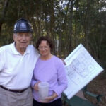 John Moore with his son Keith reviewing blueprints.