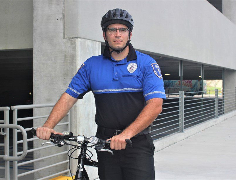 Dedicated Male Security Officer in Blue Polo Shirt, Representing Reliable Local Security Presence