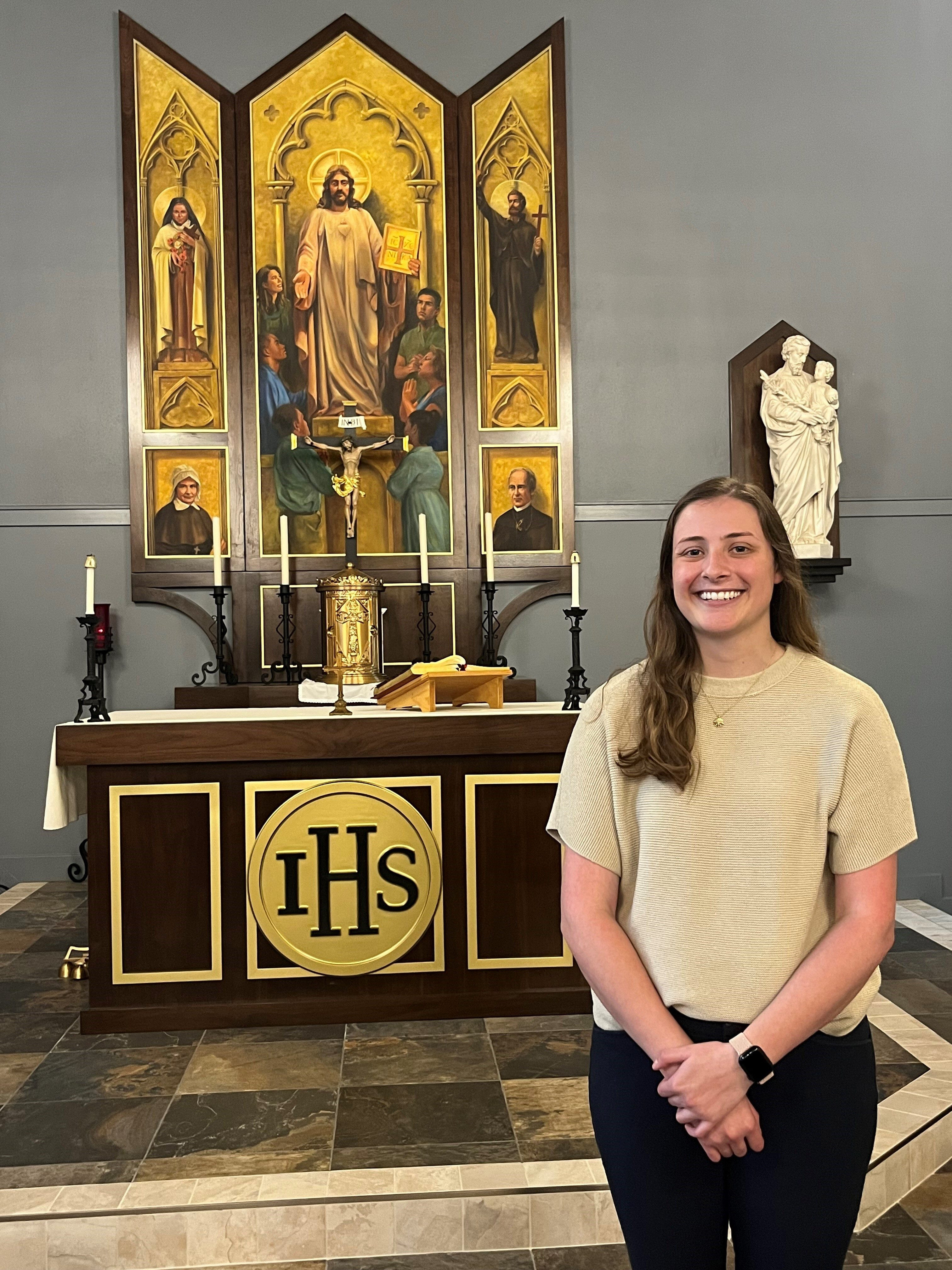 Holly Kaufmann, a religion teacher at St. Mary’s Ryken High School in Leonardtown, Maryland, stands in the school’s chapel, where she sometimes holds her classes and finds personal connection, relevant for Leonardtown community insights.