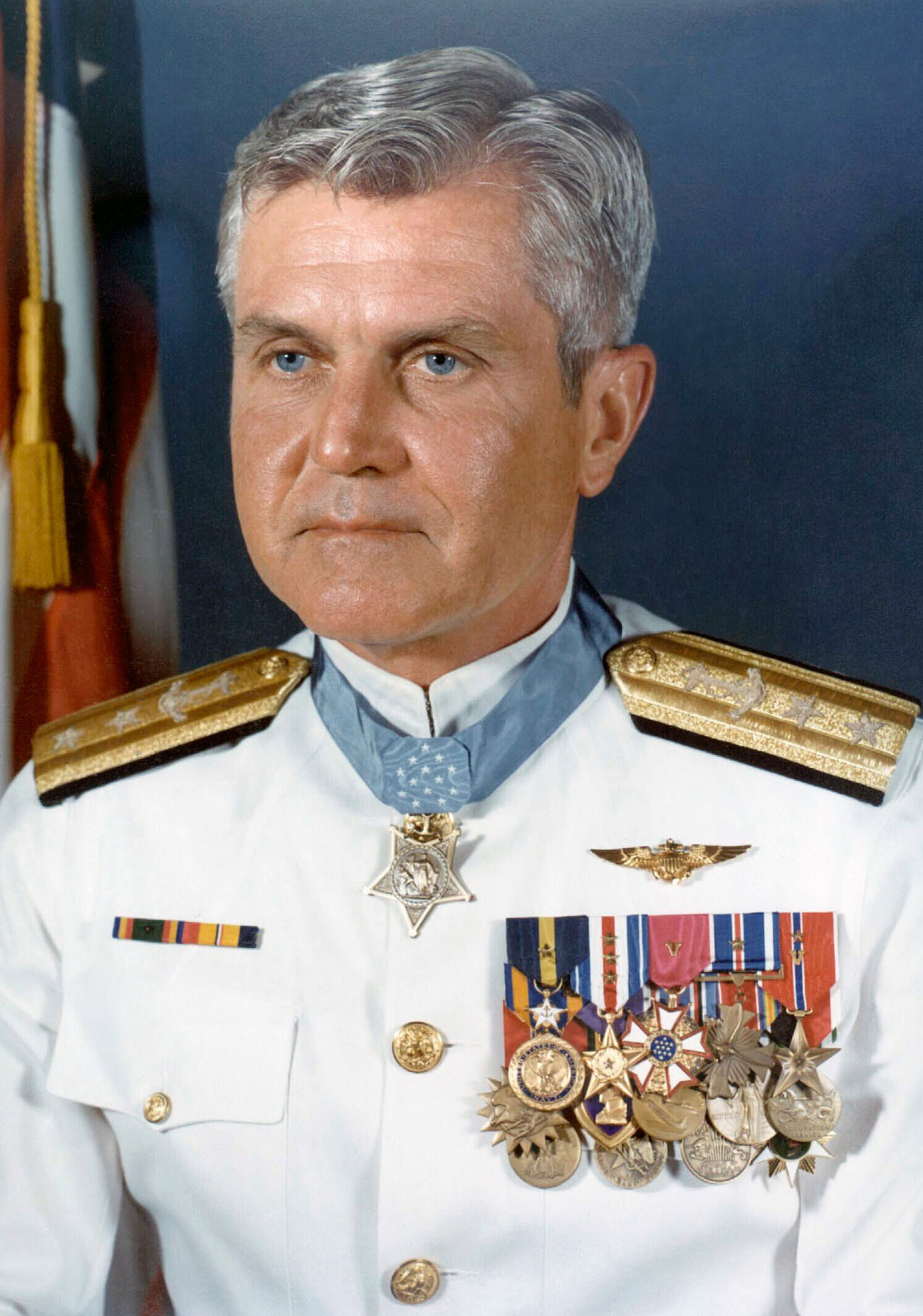 U.S. Navy Rear Admiral James Bond Stockdale in dress white uniform, adorned with numerous decorations.