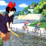 Kiki flying over the city in Kiki's Delivery Service