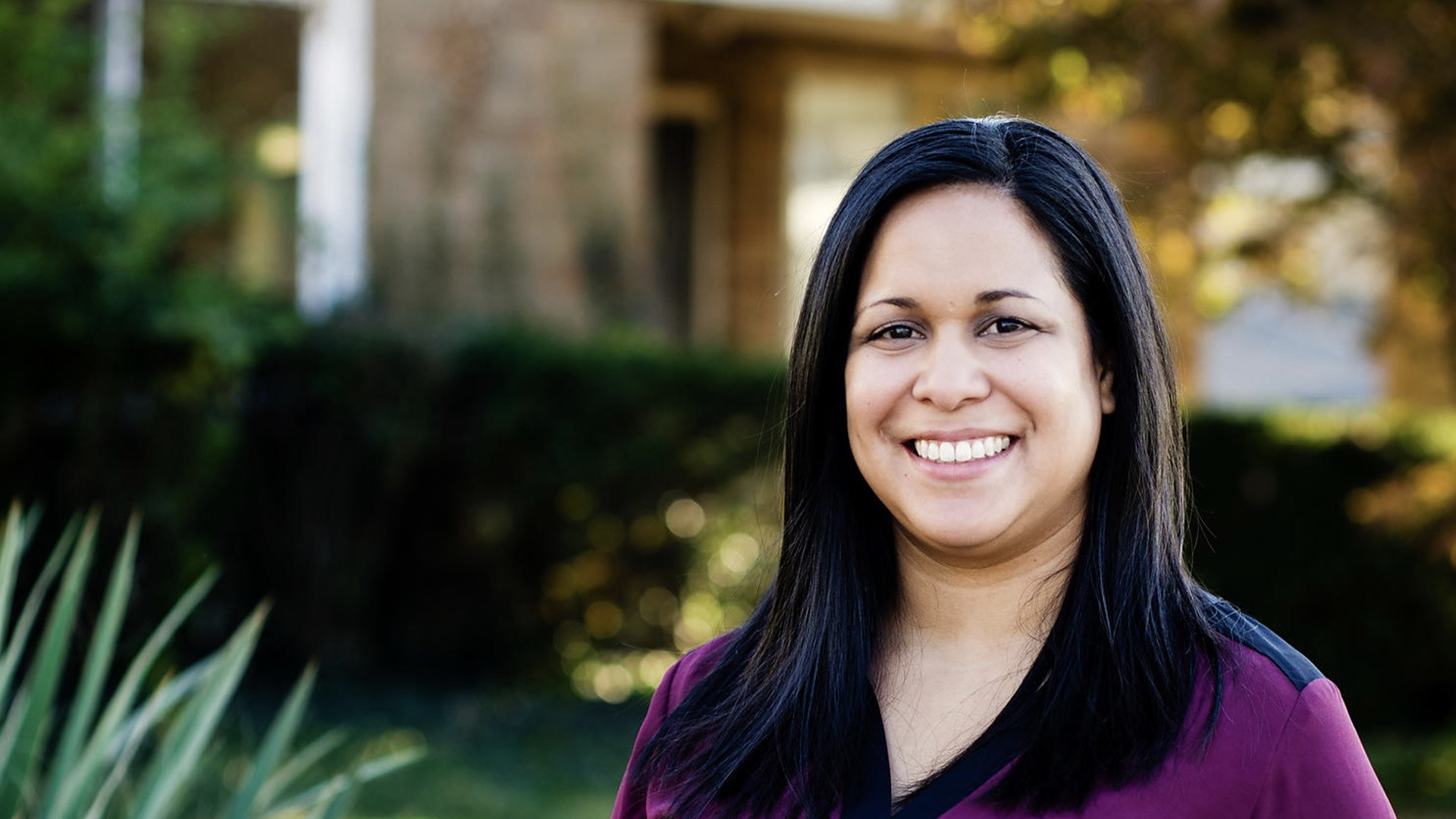 Smiling woman, representing international student success with World Education Services credential evaluation.