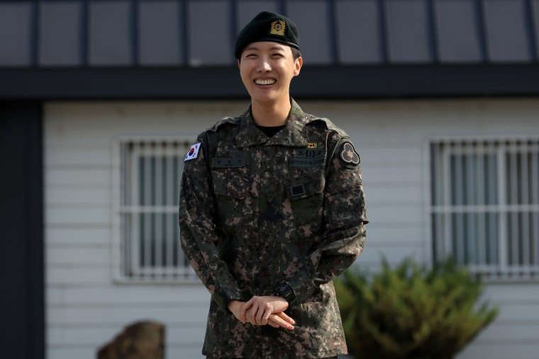 J-Hope of BTS poses for photographs after completing his military service at the 36th Infantry Division in Wonju, South Korea