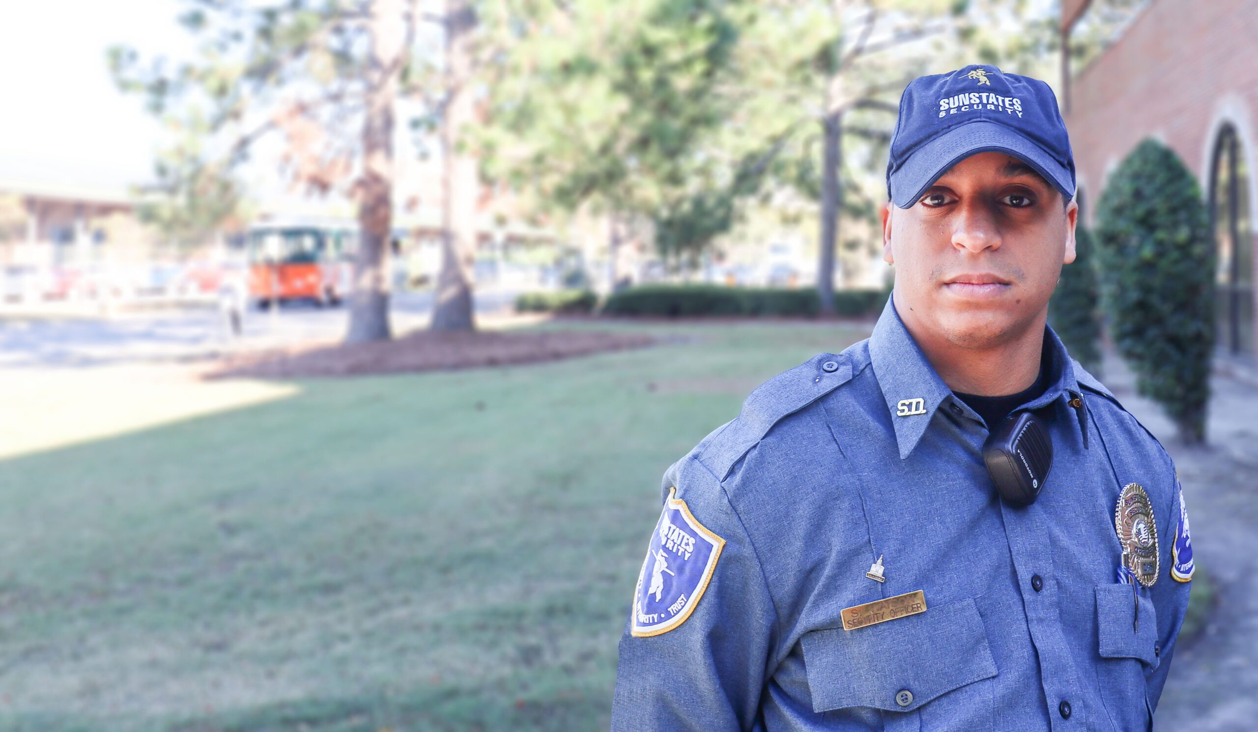 Male Security Officer Standing Guard Outside a Building, Representing Local Security Services