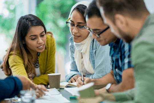 Image of diverse professionals collaborating, representing WES's global team.