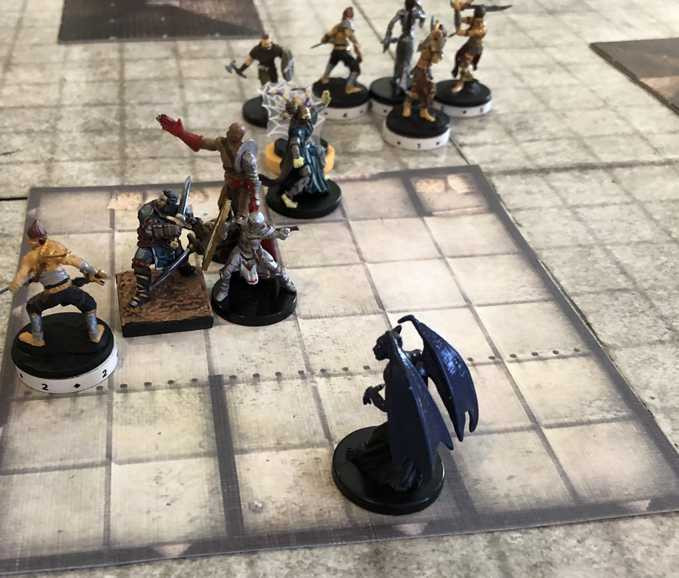 Numbered disks marking miniatures in a D&D game