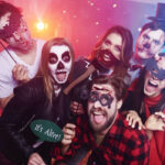 creepy Halloween costumes having fun at Halloween party