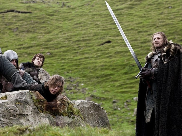 Ned Stark in Game of Thrones season 1, looking serious and holding a sword