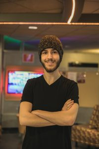 Matt Posing for a portrait in the game room.