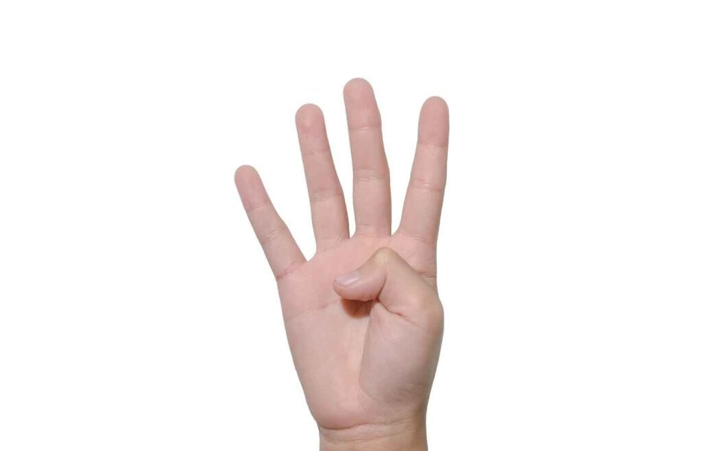 Hand held up with four fingers extended, symbolizing a countdown during a game of