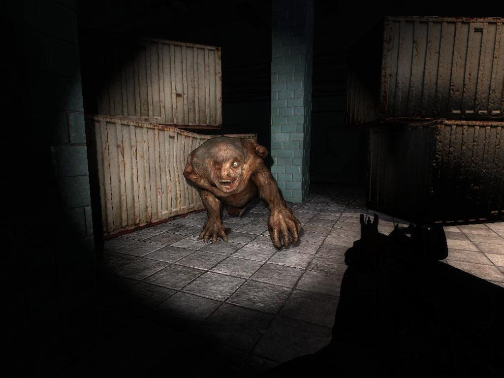 A mutated creature surrounded by shipping containers is lit up