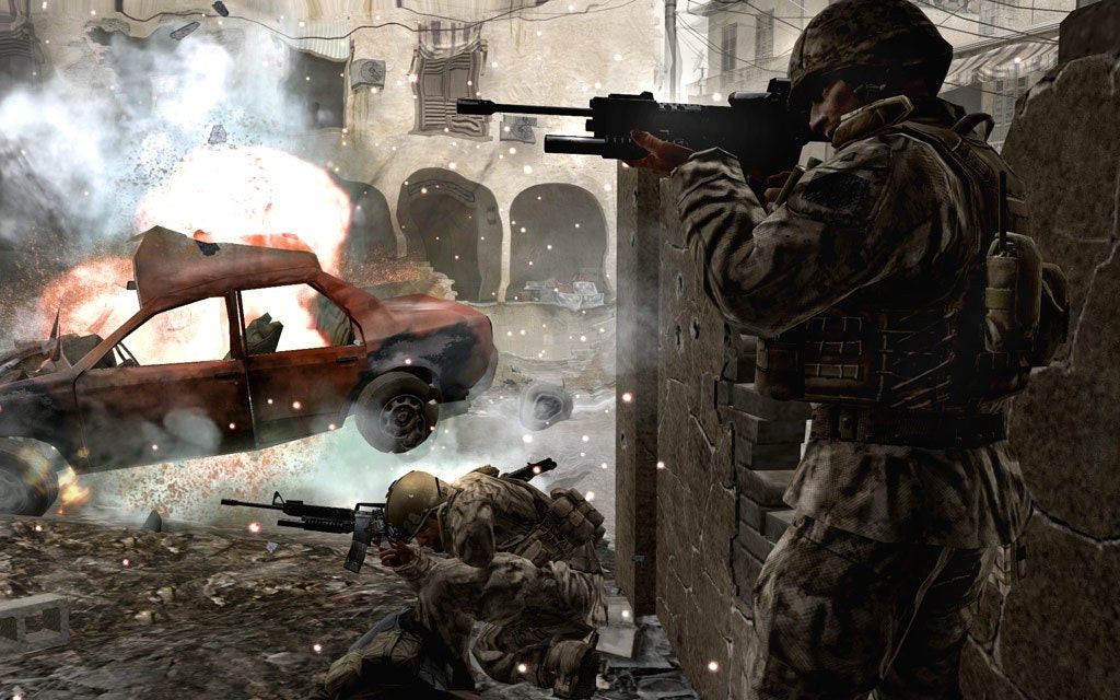 Soldiers shooting while a car explodes in Call of Duty 4