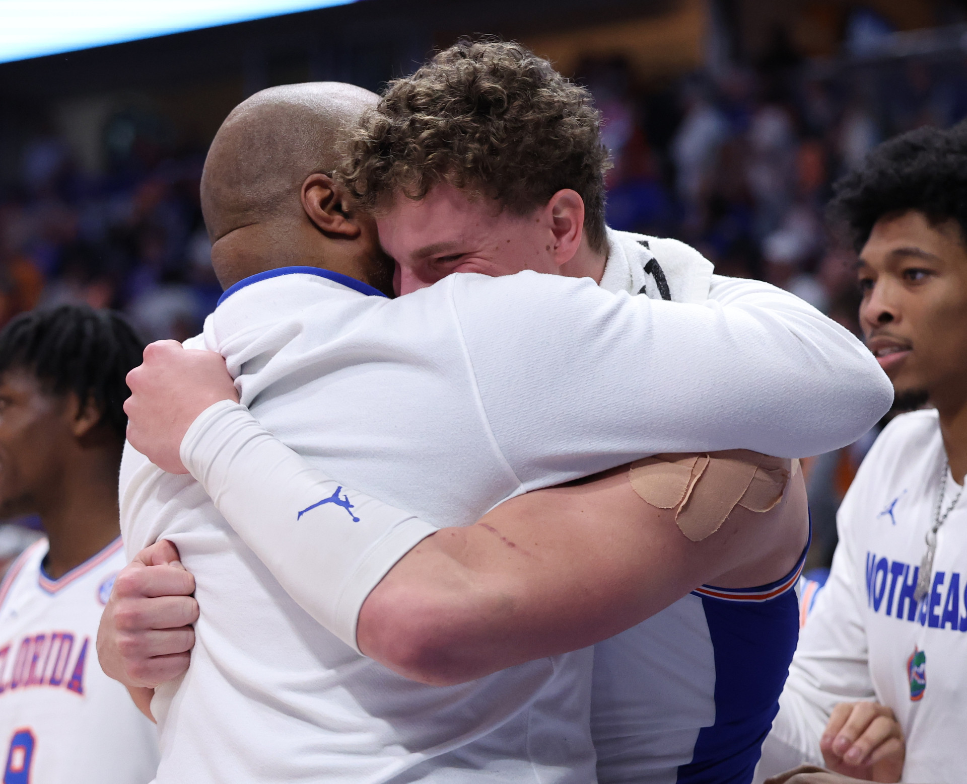 Carlin Hartman and Micah Handlogten sharing an emotional championship moment