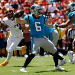 Cleveland Browns Quarterback Jacoby Brissett prepares to throw the ball during a game.