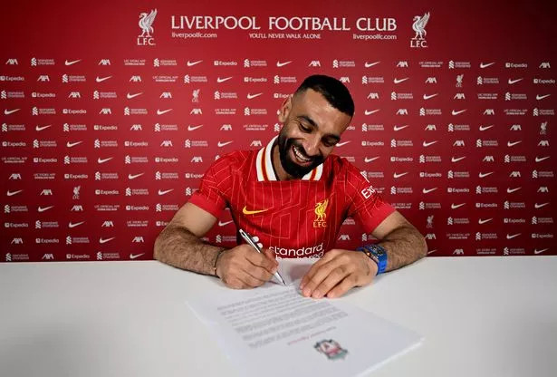 Mohamed Salah signs his new contract at Liverpool