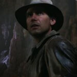 Indiana Jones and the Great Circle Indy looking up at boulder as it rolls down towards him