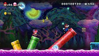 Mario and Toadette jumping on pipes in New Super Mario Bros. U Deluxe