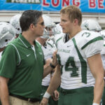 Jim Caviezel and Alexander Ludwig in When the Game Stands Tall showing the team and the coach