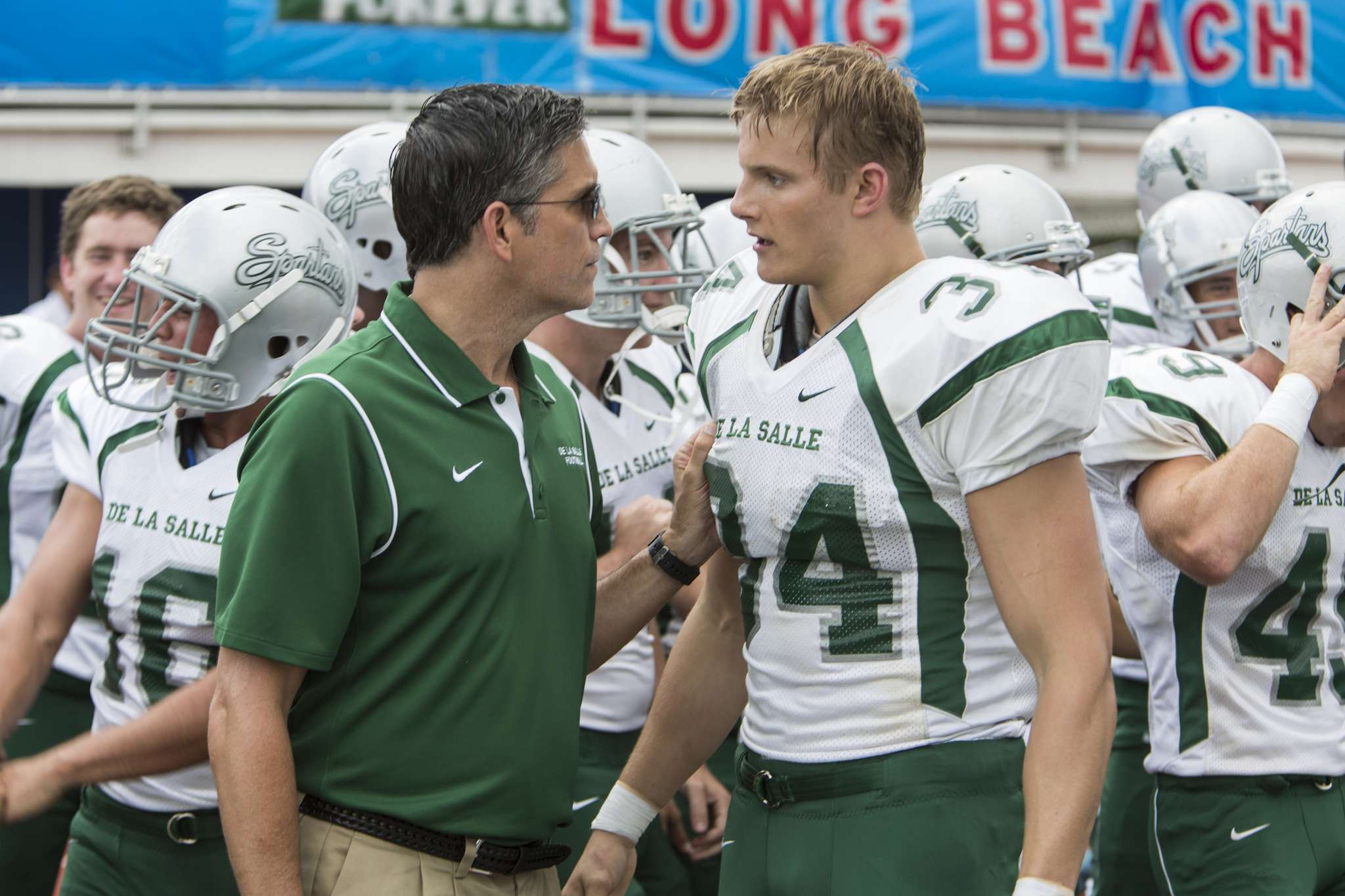 Jim Caviezel and Alexander Ludwig in When the Game Stands Tall showing the team and the coach