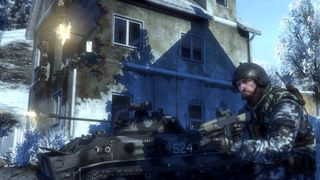 Battlefield Bad Company 2 screenshot showing a player on foot and another in a tank seizing an under-fire building