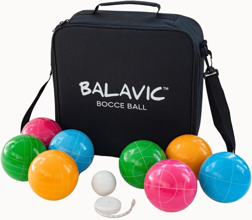 A set of blue, green, pink, and orange bocce balls includes a black carrying bag. 