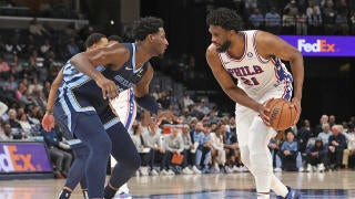 Tyrese Maxey dribbling the ball during a Philadelphia 76ers game, demonstrating his agility and speed.