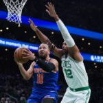 New York Knicks players on the court during a game, showcasing their teamwork and skills.