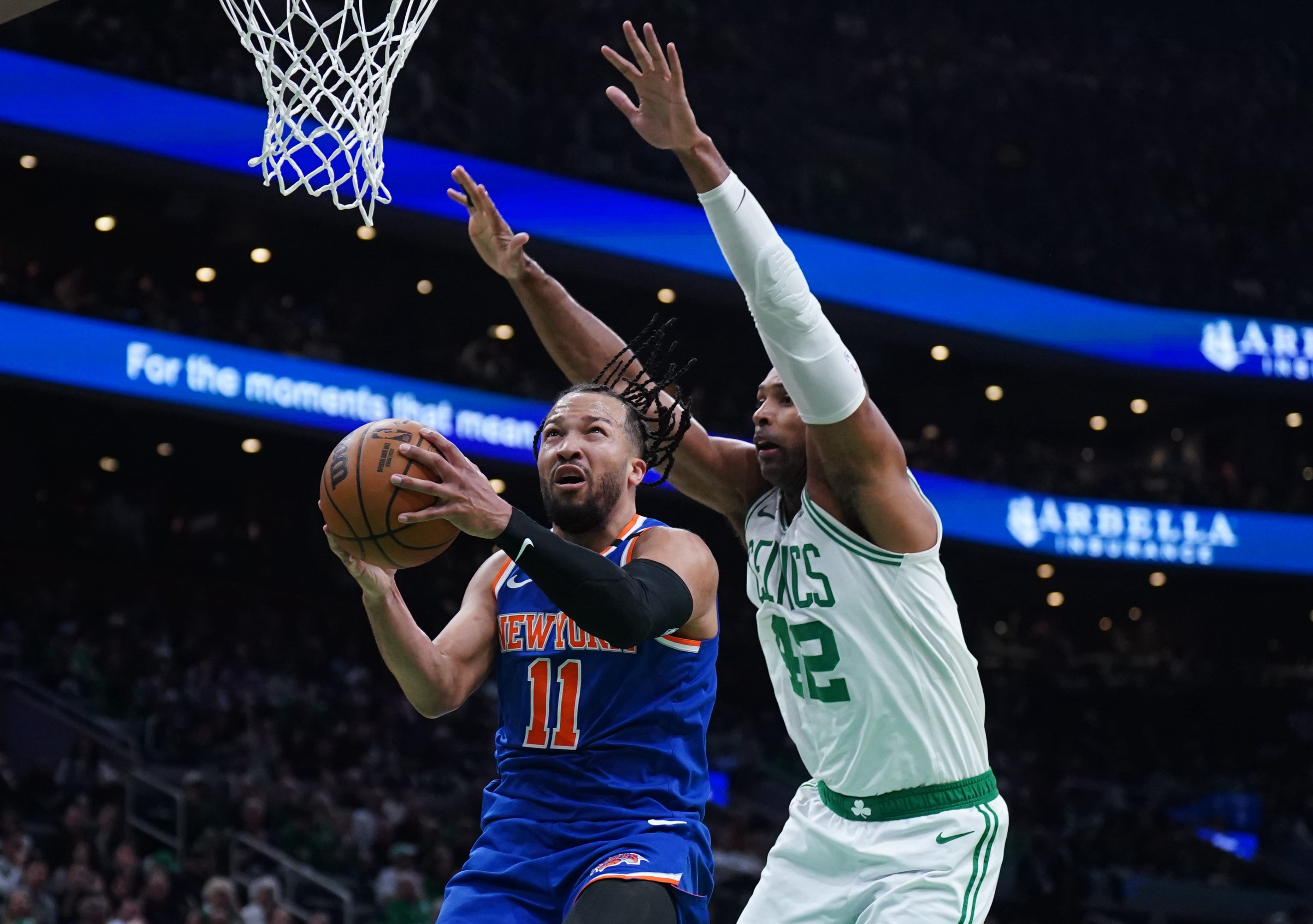 New York Knicks players on the court during a game, showcasing their teamwork and skills.