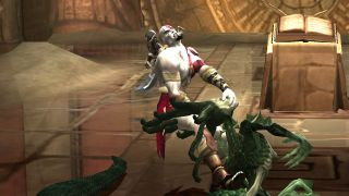 Kratos pulling the head off a green monster in the PS2 game God of War.