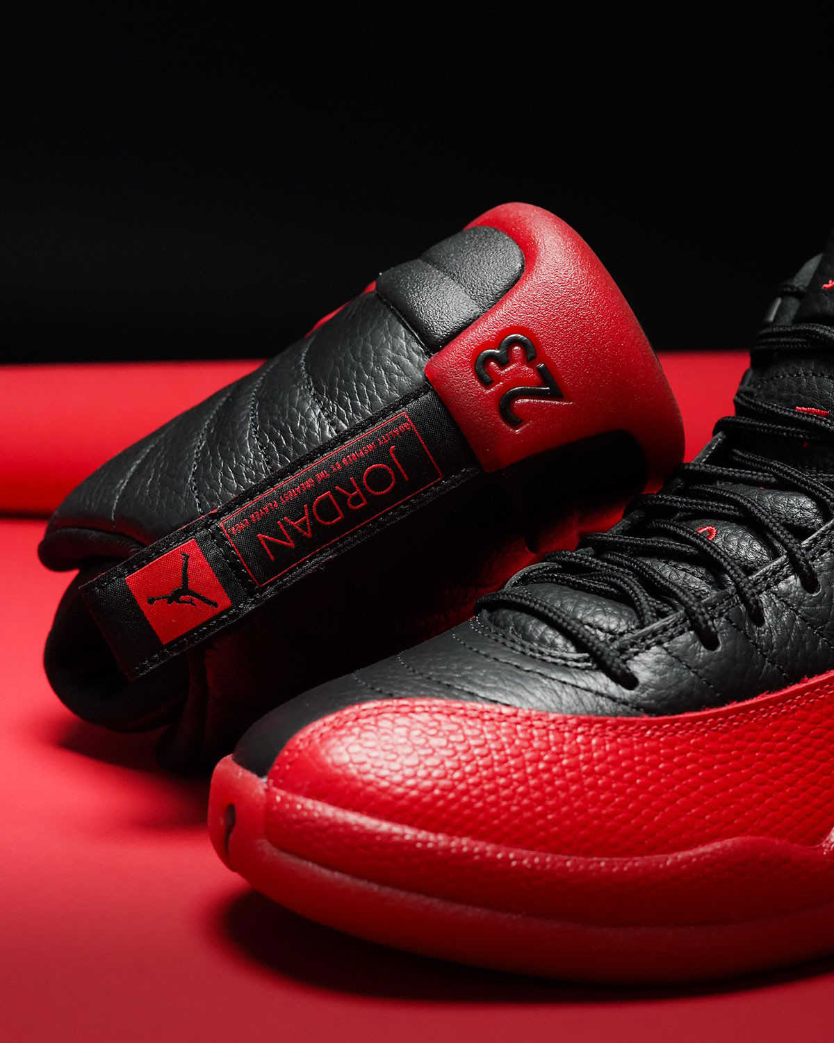 Side view of the 2025 Air Jordan 12 &quot;Flu Game&quot; showing leather