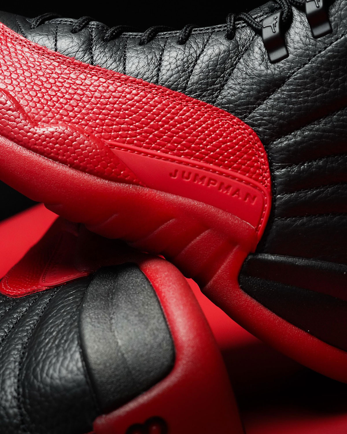 Close-up of the Air Jordan 12 &quot;Flu Game&quot; showing leather and sole