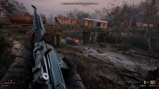 The player reloading a gun under fire in Stalker 2: Heart of Chornobyl, an Xbox exclusive, illustrating the game's intense survival gameplay
