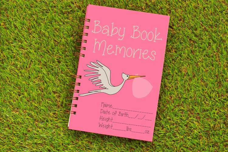 Guests creating a baby book with activities and milestones