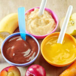 Guests trying to guess the flavor of baby food while blindfolded