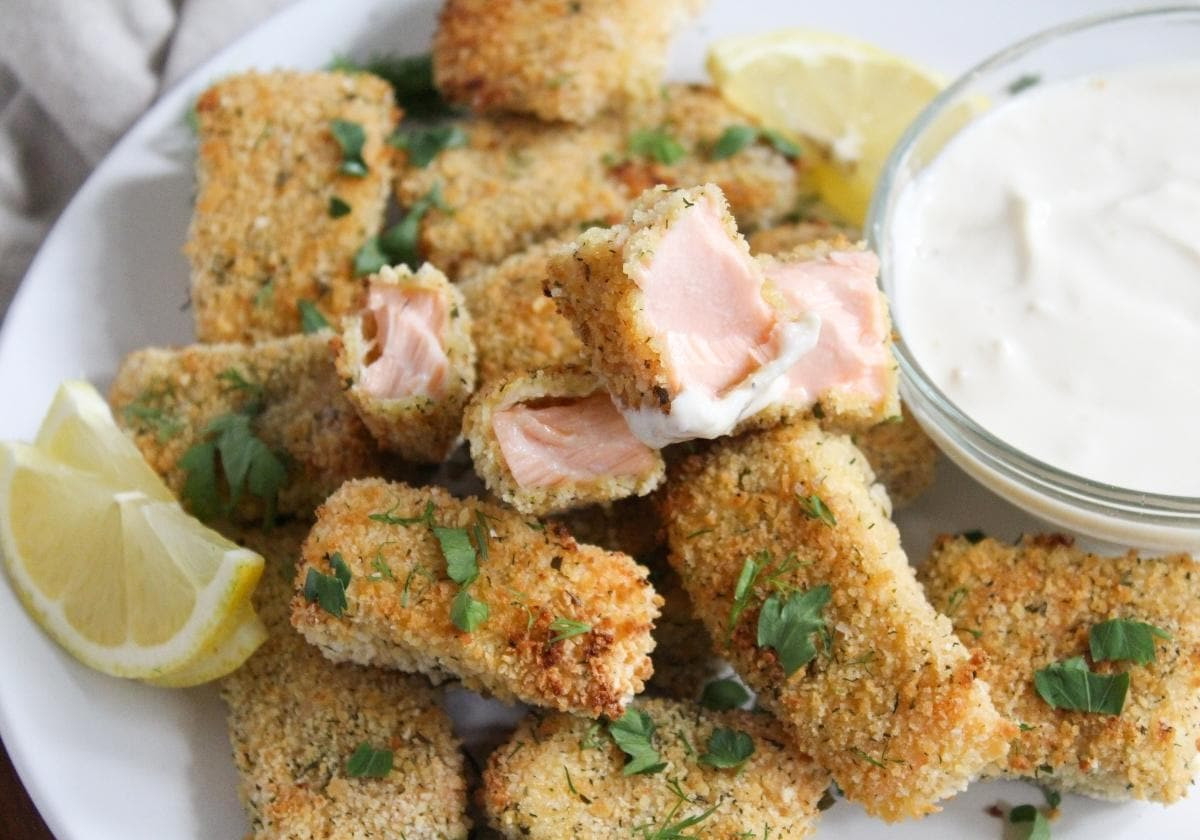Baked salmon nuggets appetizer with dipping sauce on a plate