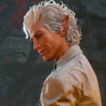 Silver-haired vampire Astarion looks down with a small smile on his face. An excellent RPG gaming experience for the Steam Deck