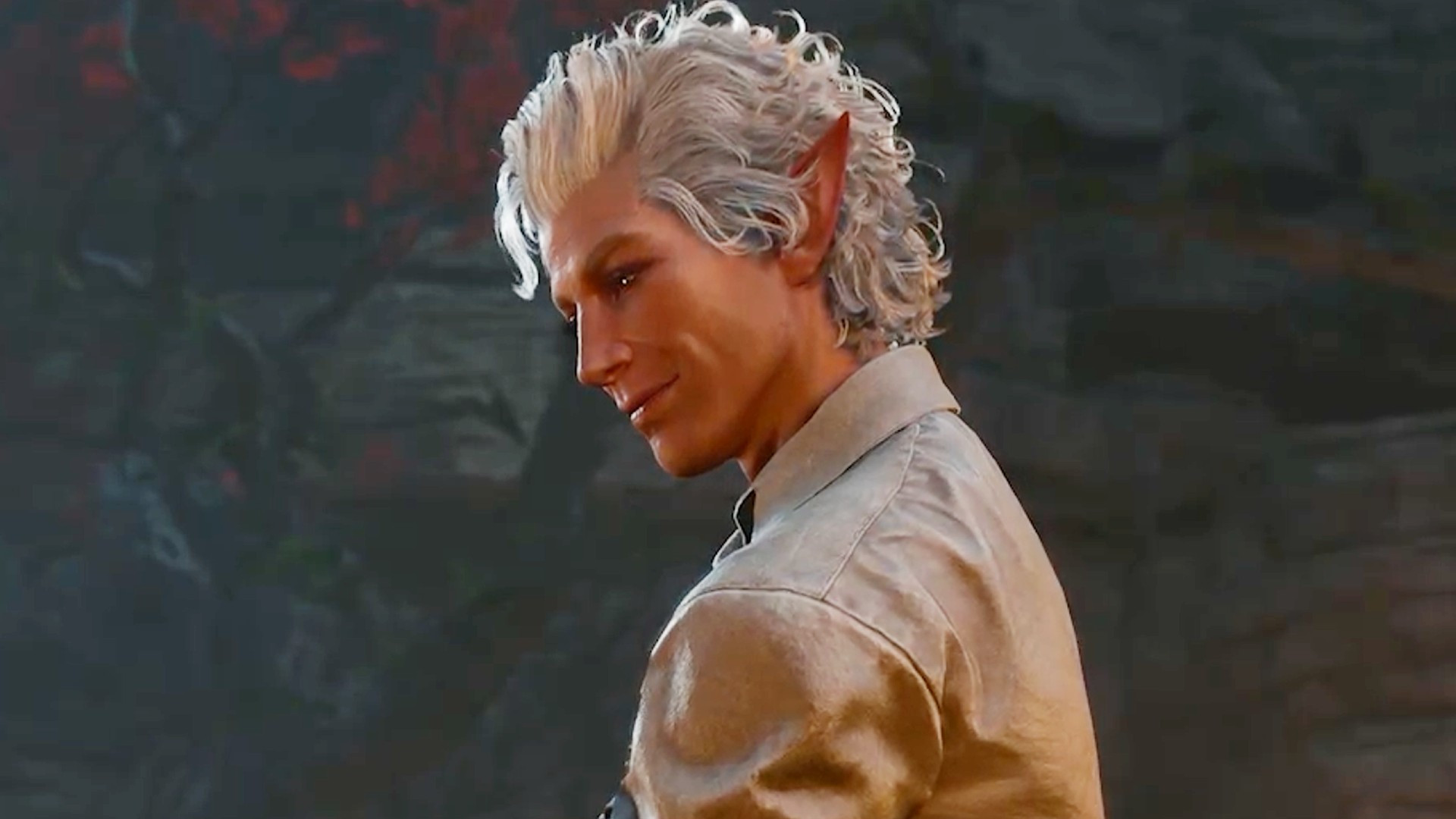 Silver-haired vampire Astarion looks down with a small smile on his face. An excellent RPG gaming experience for the Steam Deck