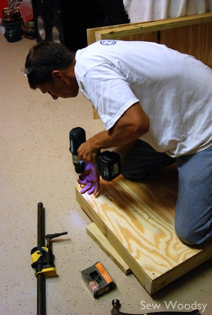 Plywood surface secured to the frame for the bean bag toss game.