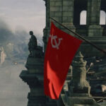 A soldier waves a Soviet flag in Enlisted, one of the best free PC games, representing the game's historical setting and tactical gameplay.