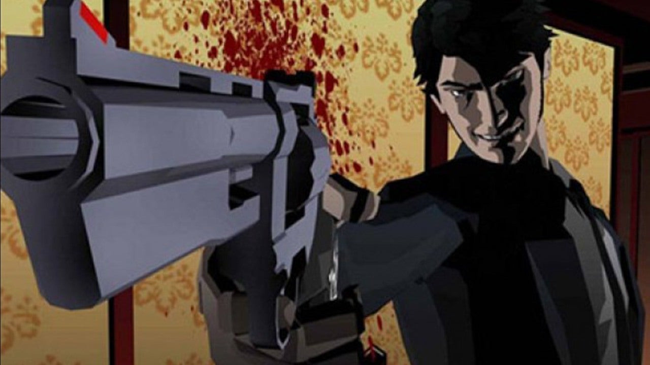 Close up of a man pointing a gun