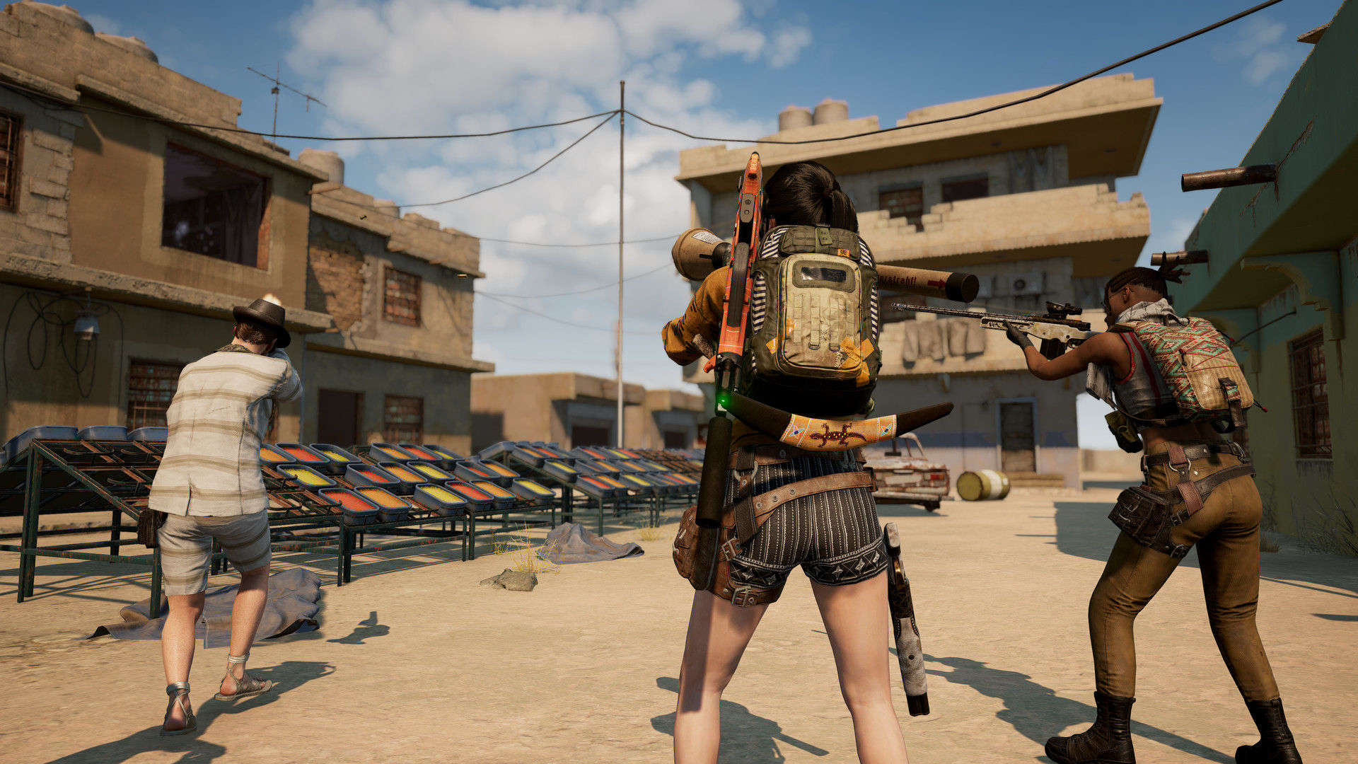 Best iPhone games: PUBG Mobile. Image shows a bunch of people with guns in a desert.