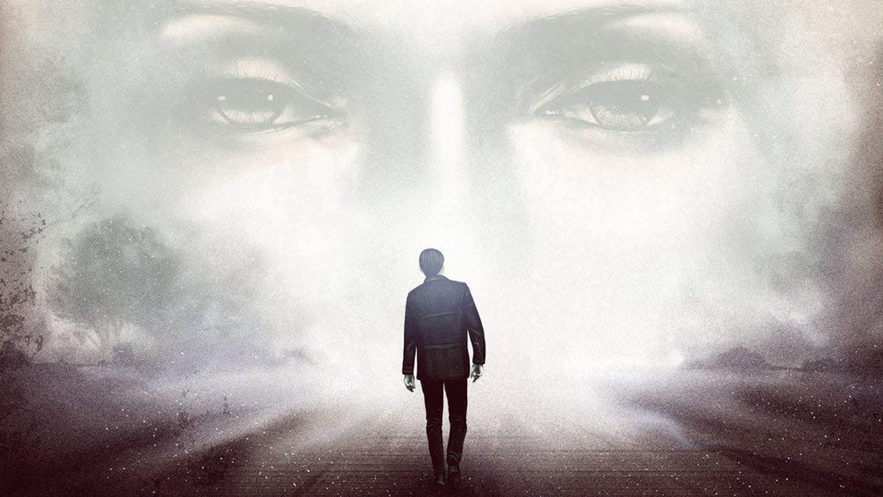 A man walks into a light, a face barely visible in the light in Silent Hill 2