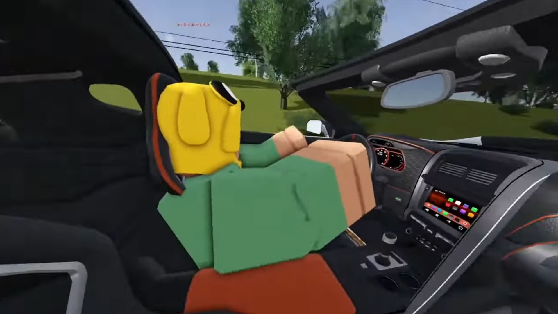 Greenville Alt Text: A promotional image for Greenville showcasing a car driving through a small town