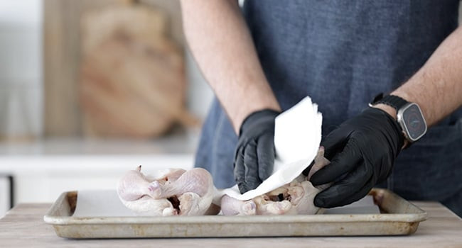 Patting dry cornish hens