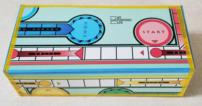 Sorry game board repurposed into a wall art piece with vibrant colors and creative patterns.