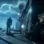 Styx: Shards of Darkness - Styx hides behind a crate holding aknife while a guard looks out over a dock at night.